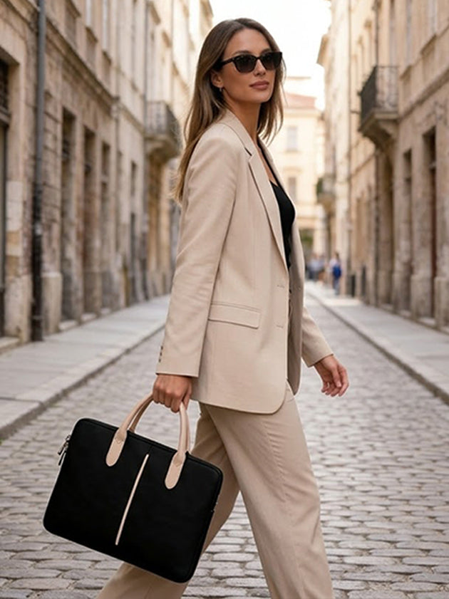 Woman walking with a stylish black bag with comfortable handles